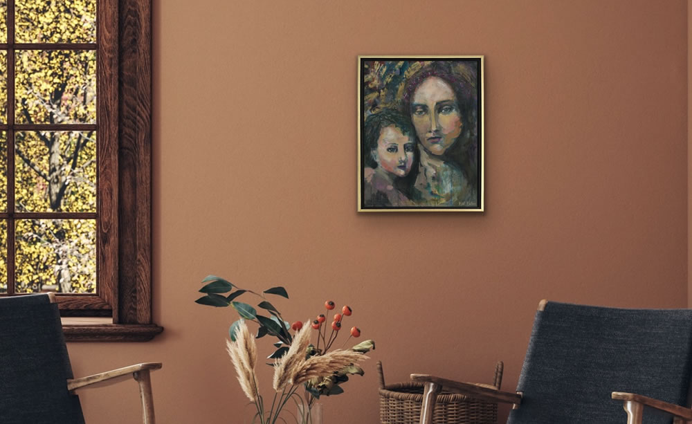 painting of mary, mother of christ on wall above comfortable chair.