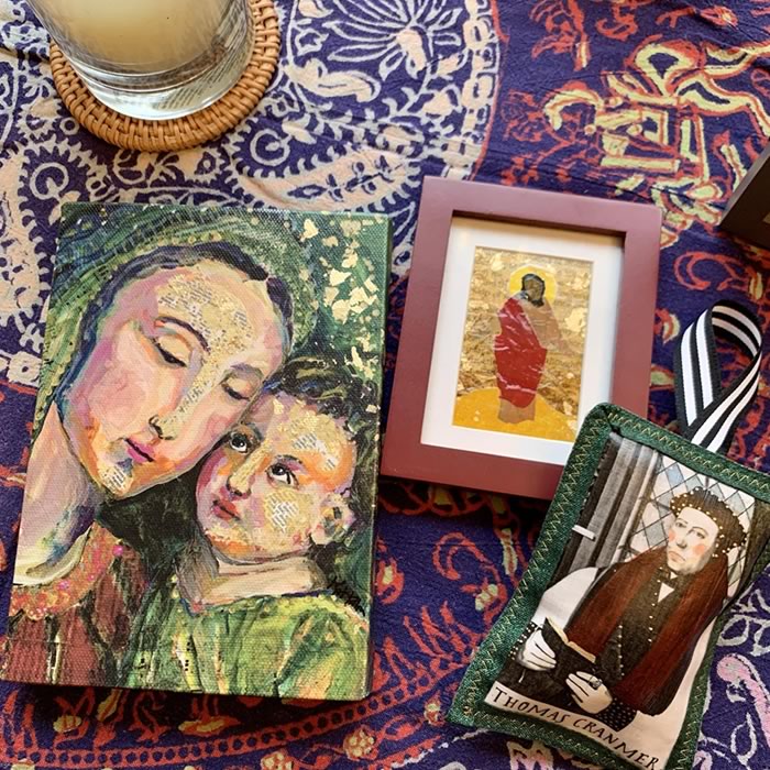 a close up of catholic art and gifts for sale on a table